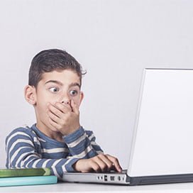 Child reacting to laptop content