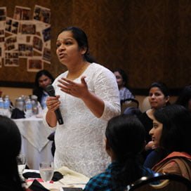 Teacher speaking with school community